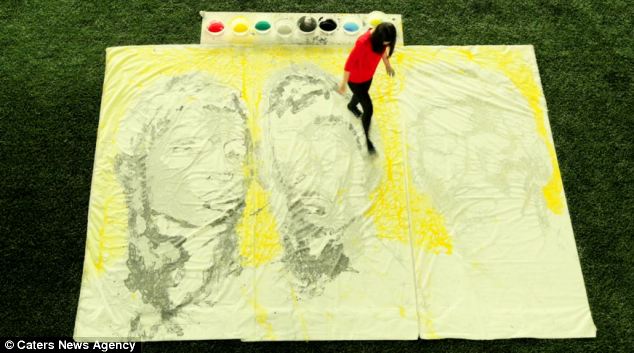 About face: Ms Yi adds details to the players' portraits