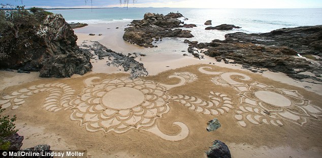 The 24-year-old from Lake Cathie, NSW, works in the wet sand at low tide meaning her drawings don't stick around for long when the waves roll in